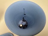 a picture of a toilet bowl with a toilet paper dispenser in it