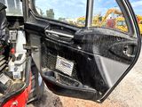 a picture of the inside of a vehicle with the door open