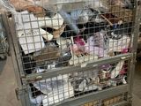 a metal cart filled with lots of items in a warehouse