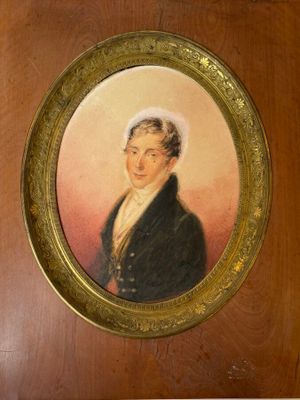 portrait of a man in a black coat and a white hat