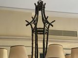 a chandelier with five lamps hanging from the ceiling