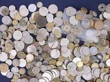 a lot of coins that are on a blue surface