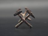 a pair of hammers sitting on top of each other on a table