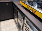 a kitchen with a stove, oven, and sink in it