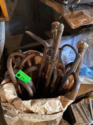 a bag with a bunch of old tools in it