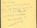 an old handwritten letter written in french on a yellow piece of paper