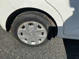 a white car that has a flat tire on it