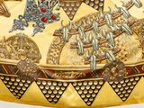 a yellow bag with a picture of a man riding a horse on it