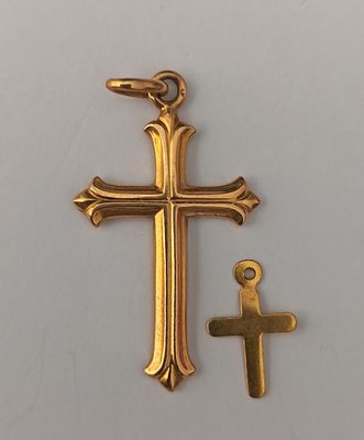 une image représentant une croix et une petite croix sur un fond blanc