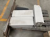 a pile of bricks sitting on a pallet in a warehouse