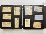 a black binder with a lot of old stamps on it