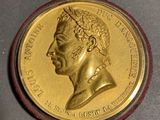 an image of a gold coin with a portrait of a man