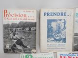 several books are sitting on a table next to each other