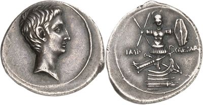 a close up of a coin with a woman on it