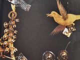 a picture of a picture of a necklace with birds on it