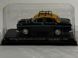 a black car with a yellow top in a glass case