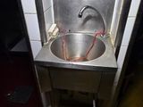 a sink that is in the corner of a room