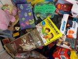 a pile of children ' s toys and books in a bin