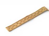 an image of a wooden ruler on a white surface