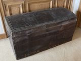 an old trunk sitting on the floor in a room