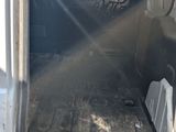 a white van that is sitting in the back of a truck