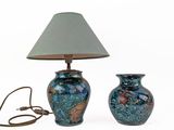 two blue vases sitting next to each other on a white surface