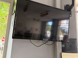 a flat screen tv mounted on a wall in a room