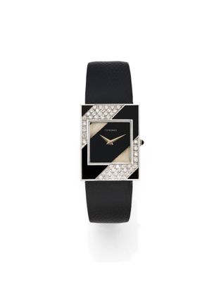 a black and white watch with diamonds on the face