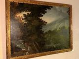 a painting on the wall above a bed in a room