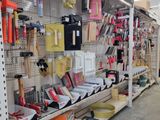 many different tools on the shelves in the store