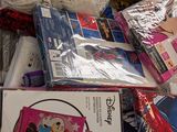 a pile of children ' s clothing on the floor
