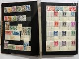 an open book with stamps on it on a table