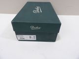 a green box that is sitting on a white table