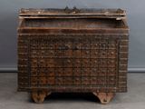 an old wooden chest sitting on a cement floor