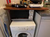 a washer and dryer in a small kitchen