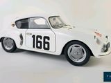 a small white car with a number on the side of it