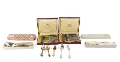 a lot of silverware in a case on the table