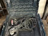 a tool in a tool box that is sitting on the floor