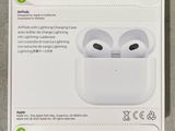 an apple airpods with lightning charging case in packaging on a table