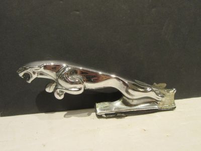 a silver metal object that is on a table