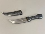 two knives that are sitting next to each other on a table