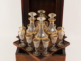 an old fashioned glass decanter set in a wooden box