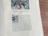 a book open on a table with a picture on it