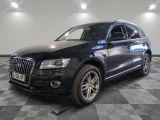 an image of a black audi suv parked in a garage