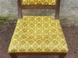a chair that has a yellow seat on it