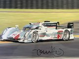 une photo d'une voiture de course en pleine course sur le circuit