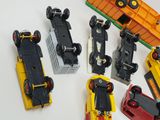 many toy cars that are lined up on a table