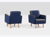two blue chairs with wooden legs sitting next to each other