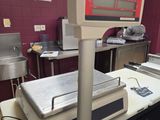 an image of a medical room with a scale on the table