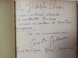 a handwritten note in a book on a table